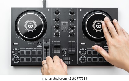 Dj Hands Is Scratching And Mixing Digital Dj Deck Controller, Topview, Isolated On White.