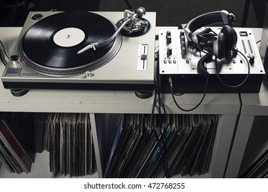 DJ Mixer And Headphones With A Vinyl Record, Close Up.