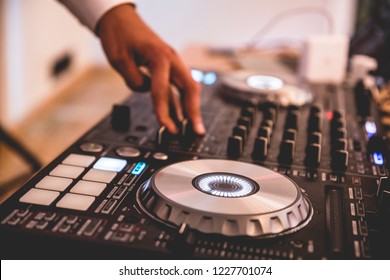 DJ mixer, DJ mix music on the console, the DJ's hand