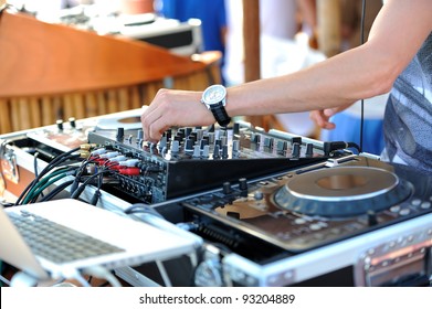 Dj Mixes The Track In The Beach Bar