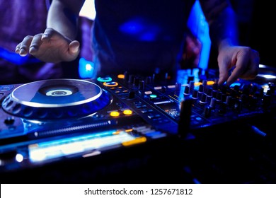 Dj mixes the track in the nightclub at party - Shutterstock ID 1257671812