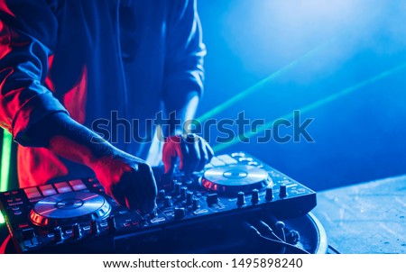 Dj mixes the track in the nightclub at a party, Christmas, new year Сток-фото © 