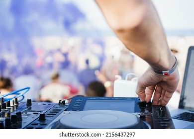 Dj Mixing At Beach Party During Summer Vacation Outdoor - Focus On Right Hand