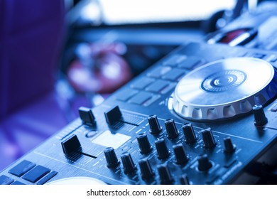 DJ mixing desk in cool tone
