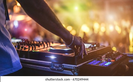 Dj Mixing Outdoor At Beach Party Festival With Crowd Of People In Background - Summer Nightlife View Of Disco Club Outside - Soft Focus On Hand - Fun ,youth,entertainment And Fest Concept