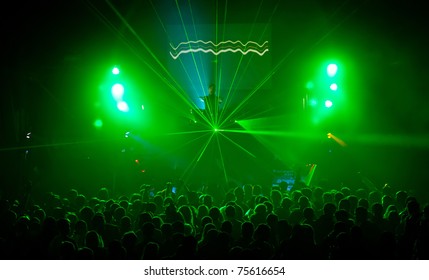 A Dj Performing At A Disco Rave Party