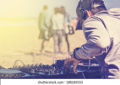 Dj Playing Music At A Beach Party