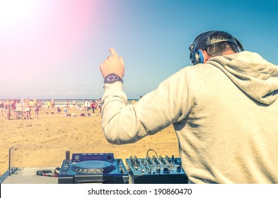 Dj Playing Music At A Beach Party