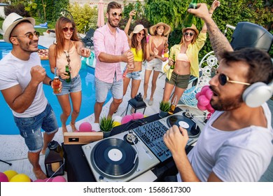 Dj Playing Music At  Pool Party.People,music,happiness And Fun Concept.