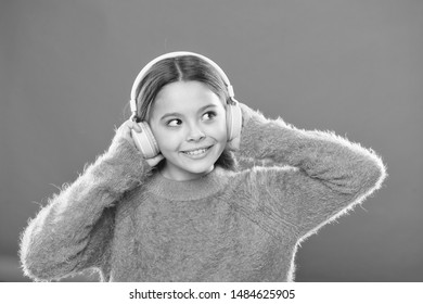 DJ, Put The Record On. Cute Small Child Wearing DJ Headphones. Little Girl Listening To Music And Dancing On Silent Disco In Earphones. Adorable DJ Girl. Enjoying Music Playing On DJ Party.