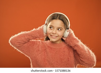 DJ, Put The Record On. Cute Small Child Wearing DJ Headphones. Little Girl Listening To Music And Dancing On Silent Disco In Earphones. Adorable DJ Girl. Enjoying Music Playing On DJ Party.