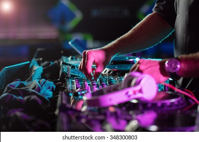 DJ sound equipment at nightclubs and music festivals, EDM, future house music and so on. Parties concept, sound technique. DJ playing on the best, famous CD players. - Shutterstock ID 348300803