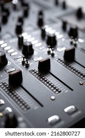Dj sound mixer device in sound recording studio. Play and remix music with professional audio equipment. Curated collection of royalty free music images and photos for poster design template 