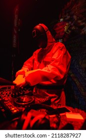 DJ In A Squid Games-themed Costume Plays At The Party. Red Lighting. Party Concept, Night Club. Russia, Rostov-on-Don 5feb2022