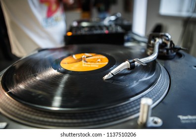 Dj turn table Technics SL-1210 playing vinyl record with music. Retro turntables needle scratching records on hip hop party. Disc jockey audio equipment on concert stage. KYIV-30 JUNE,2018:  - Shutterstock ID 1137510206