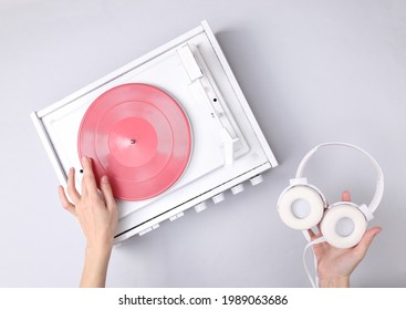 DJ Turntable, Hand Placing Tonearm On White Vinyl Record. Music Concept. Top View