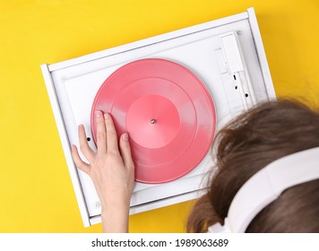 DJ Turntable, Hand Placing Tonearm On White Vinyl Record. Music Concept. Top View