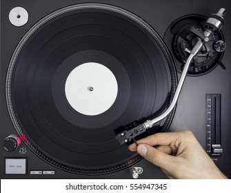 DJ Turntable, Hand Placing Tonearm On Vinyl Record, Top View