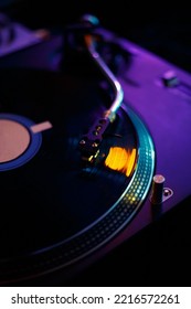 DJ Turntables Needle On Vinyl Record With Music. Professional Disc Jockey Turn Table Player On Concert Stage. Disk Jokey Turntable Playing Musical Tracks On Hip Hop Party In Night Club