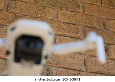 dji mavic mini photography drone against brick wall background.