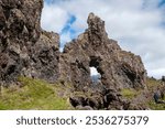 Djupalonssandur Beach Iceland, basalt rock formation with hole or archway