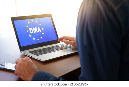DMA and the flag of the european union displayed on a modern laptop.DMA or Digital Markets Act concept. - Shutterstock ID 2150619967