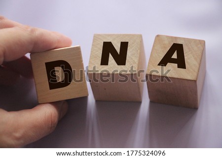 DNA abbreviation on wooden Building Blocks. Genetics concept.