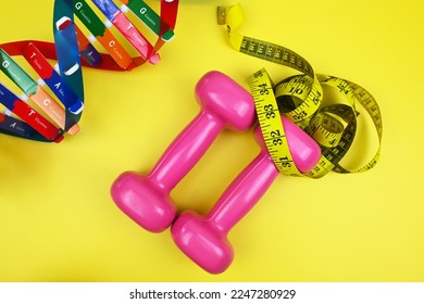 DNA helix structure, dumbbells, tape measure. Personalized DNA Diet. Diet can be created from each gene and suited each individual. Healthcare and medical concept - Shutterstock ID 2247280929