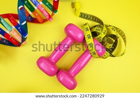 DNA helix structure, dumbbells, tape measure. Personalized DNA Diet. Diet can be created from each gene and suited each individual. Healthcare and medical concept