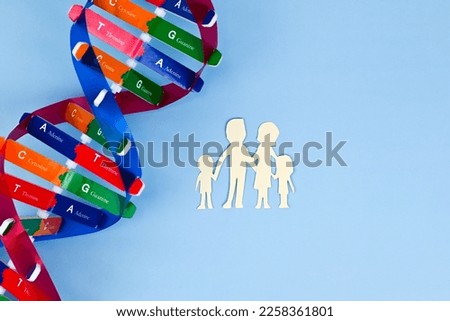 DNA helix structure and family paper model. Parents and children. DNA carrier status. Healthcare, science and medical concept.