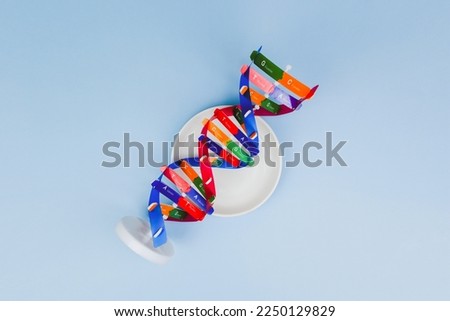 DNA helix structure on the white plate. Personalized nutrition, DNA and nutritions effect human life, DNA food and genetically modified foods