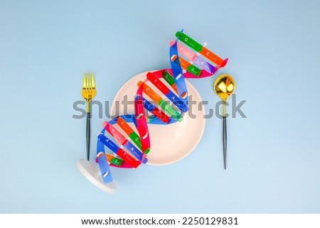 DNA helix structure, spoon, fork beside. Personalized food DNA and nutrition, checking allergic food, food intolerance, nutrition effect human life, DNA food and genetically modified foods