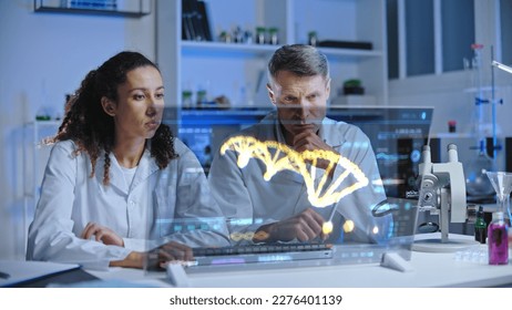 DNA scientists looking at DNA sequence on screen, puzzled with experiment results