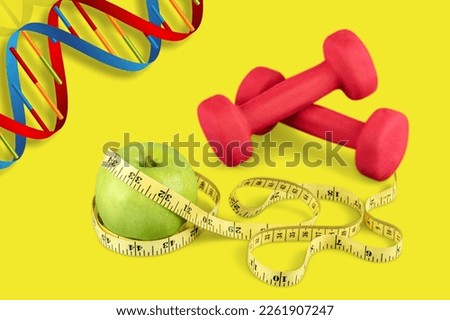 DNA structure, sport dumbbells and tape measure on desk