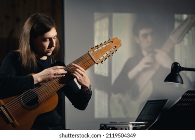 Dnepr, Ukraine- April 15, 2021: Man Play Acoustic An Electric Acoustic Ten-string Midi Guitar With Online Livestream Performance On Screen