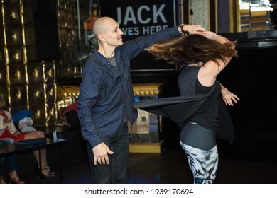 Dnepropetrovsk, Ukraine - 02.24.2017: Dance Evening In The City Cafe. A Couple Of Young People Dancing Salsa.