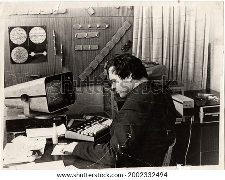 Dnepropetrovsk, USSR - 02.18.1988: A young scientist masters the Soviet computer DZ-28.
