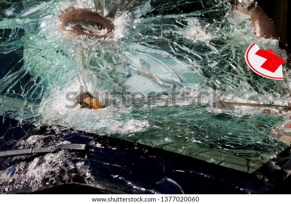 Dnipro. Ukraine 10/06/2018. View of the broken\
windshield at the military medical machine, with bullet holes,\
which is located in the museum of the\
A
