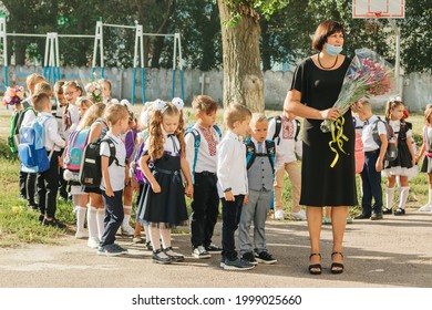 
Dnipro, Ukraine. 1st September 2020 - First Graders Stand In Pairs Next To Their Teacher During The September 1st Celebration.