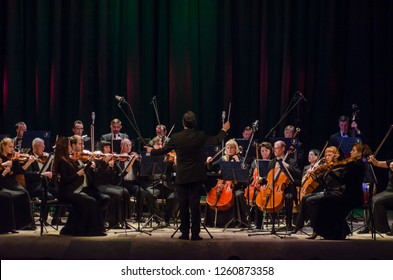 DNIPRO, UKRAINE - DECBER 17, 2018: FOUR SEASONS Chamber Orchestra - main conductor Dmitry Logvin perform  at the State Drama Theatre.