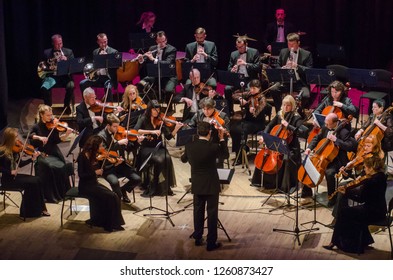 DNIPRO, UKRAINE - DECBER 17, 2018: FOUR SEASONS Chamber Orchestra - main conductor Dmitry Logvin perform  at the State Drama Theatre.