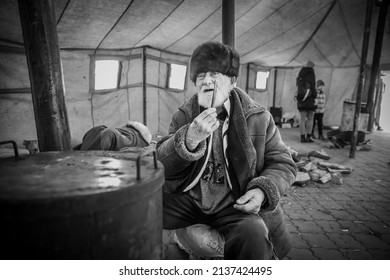 Dnipro, Ukraine - Mar 12, 2022 railway station, aid, refugees, humanitarian, tent, pensioner, homeless, evacuation