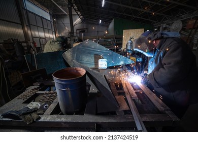 Dnipro, Ukraine - Mar 16 2022 Workshop, welder, sparks, hood, fire, war, production, defense