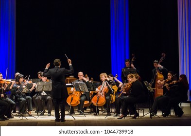 DNIPRO, UKRAINE - MARCH 12, 2018: FOUR SEASONS Chamber Orchestra - main conductor Dmitry Logvin perform at the State Drama Theatre.