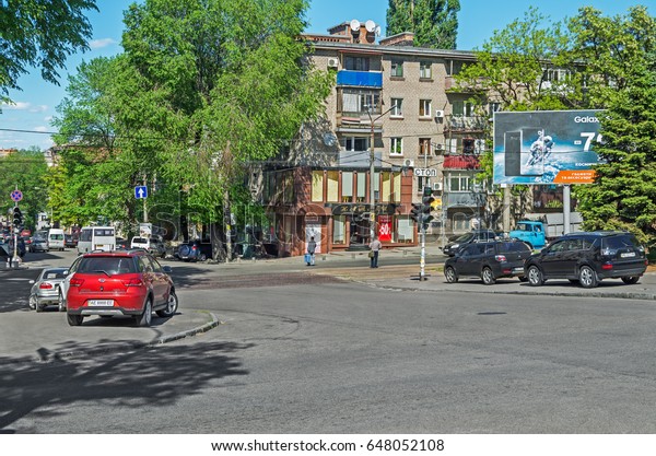 Dnipro, Ukraine - May 17, 2017: Illegal parking on\
a sidewalk in downtown Dnipro. Violation of parking rules and\
rights of pedestrians with the full connivance of authorities and\
inactivity of police