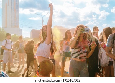 DNIPRO, UKRAINE – May 25, 2017. Crowd of happy young people have fun in colors during festival of colors ColorFest