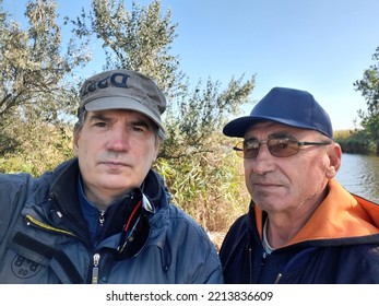 Dnipro, Ukraine, September 2022, Men On A Fishing Trip Have A Photo Session In Nature And Recreation