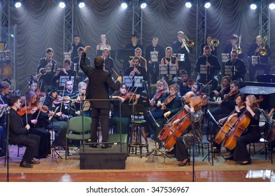 DNIPROPETROVSK, UKRAINE - DECEMBER 4, 2015: Youth Symphony Orchestra FESTIVAL - Main Conductor Dmitry Logvin Perform At The Concert Hall.