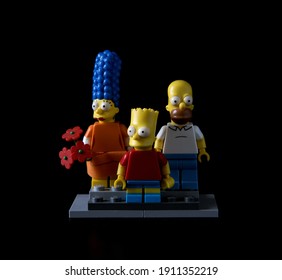 Dnipropetrovsk, Ukraine - February 07, 2021: Figures Lego Simpsons On A Black Background. Bart, Marge And Homer