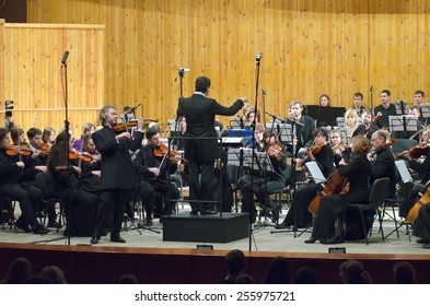 DNIPROPETROVSK, UKRAINE -?? FEBRUARY 23: Famous Violinist Alksandr Trostyansky And Youth Symphony Orchestra FESTIVAL  Perform At The Conservatory On Feb. 23, 2015 In Dnipropetrovsk, Ukraine